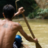 Man rowing a canoe