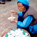 Old woman on a market in Shaping