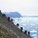 Group ascending a steep slope