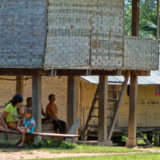 Lao people under a cabin in the shadow