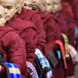 Waiting monks for the rice kettles